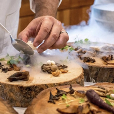 Mushrooms being prepared in a kitchen