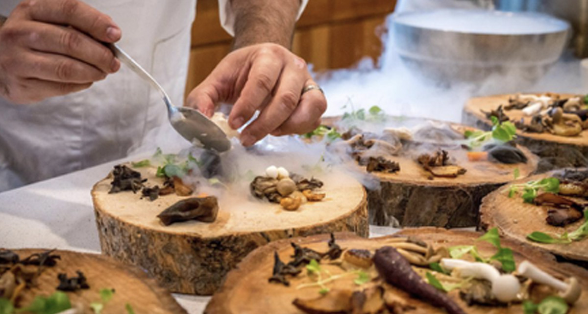 Mushrooms being prepared in a kitchen